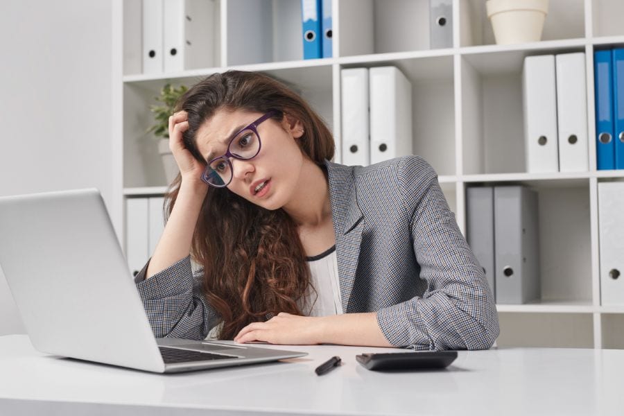 Woman Looking Confused Behind Computer